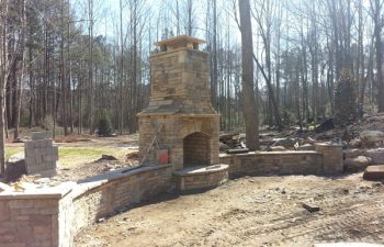 an outdoor stone fireplace