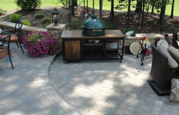 a flagstone patio with an outdoor kitchen