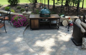 a flagstone patio with an outdoor kitchen