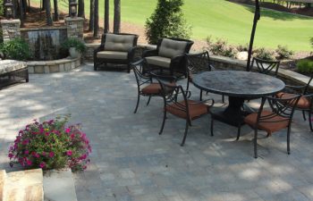 a flagstone patio with outdoor furniture