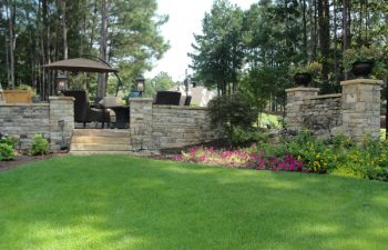 patio with stone walls in a well-cared garden