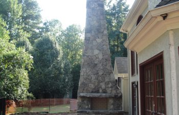 an outdoor stone fireplace