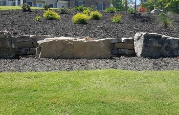 well card lawn with hardscape and retaining walls