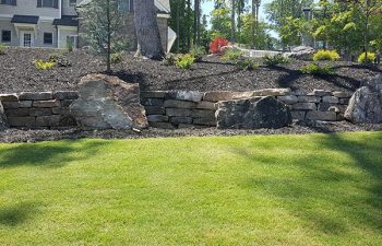 well card lawn with hardscape and retaining walls