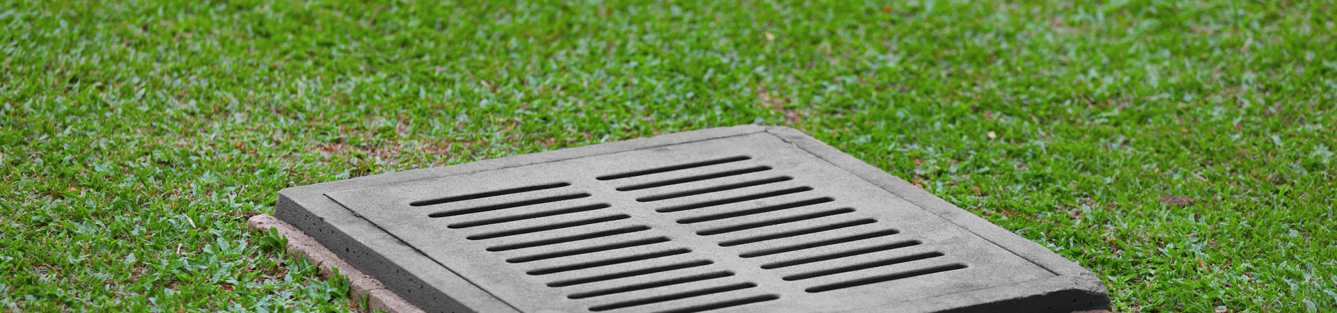 storm drain grate installed as a part of the garden drainage